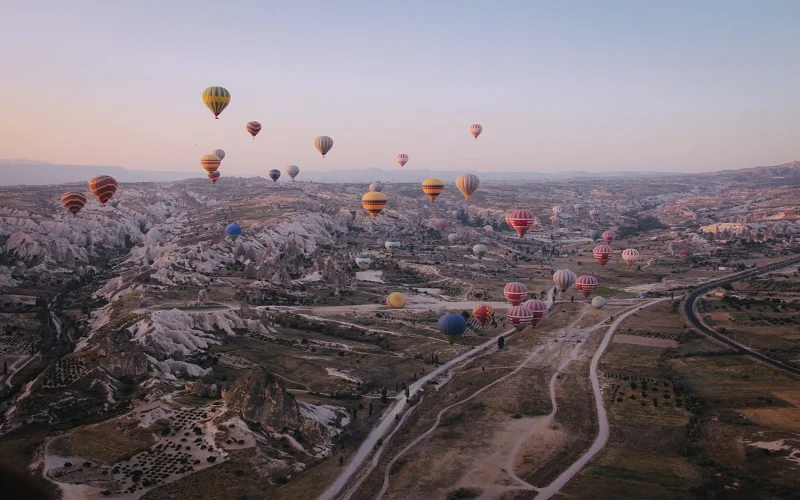 long shot various multi colored hot air balloons floating sky